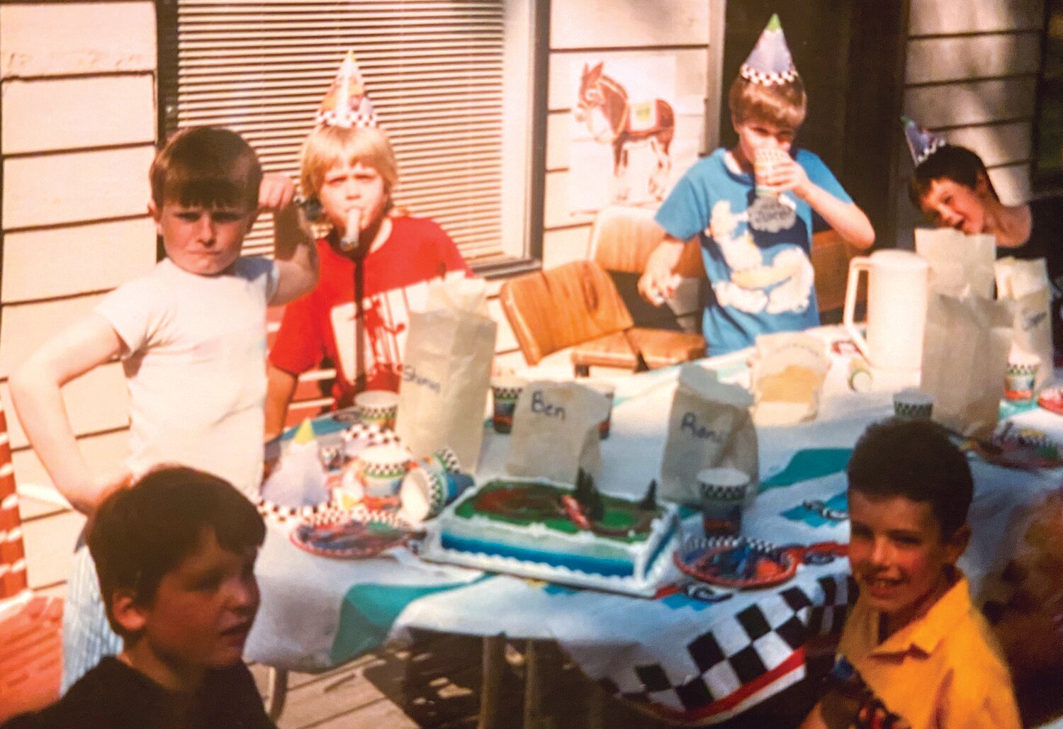 Seamus Sims (far left, in white T-shirt) with Ben Early at his seventh birthday party.
